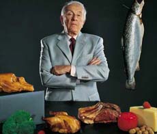 Man. Background: kitchen, cheese, fried meat, bird, fish.   ,   .